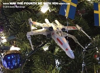 Star Wars Christmas X-Wing Ornament // Check out our blog for lots more Star Wars decor. // #starwars #starwarsparty #maythefourthbewithyou #starwarsbirthday #xwing #Christmas maythefourthbewithyoupartyblog.com