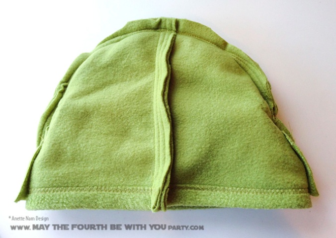 DIY Yoda Fleece hat. Check out all our other Star Wars costumes on our blog! #yoda #starwars #starwarsparty #maythefourthbewithyou #starwarsbirthday #starwarscostume #halloweencostume #cosplay maythefourthbewithyoupartyblog.com