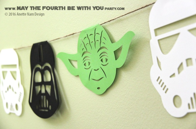 DIY Star Wars Party Garland/Flags with Yoda, Stormtrooper and Darth Vader /// We add new Star Wars crafts and fun to our blog every week! /// #starwars #theforceawakens #yoda #stormtrooper #darthvader #silhouettecameo #diecut #starwarsparty #maythefourthbewithyou #party #birthday/// maythefourthbewithyoupartyblog.com